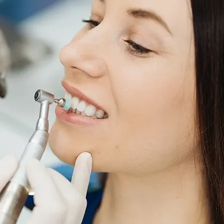 A patient getting their teeth polished