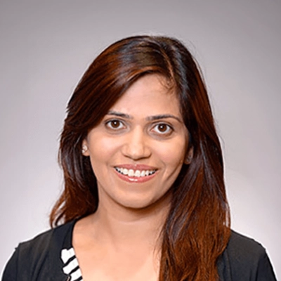 A headshot photo of dentist Jyoti Puri